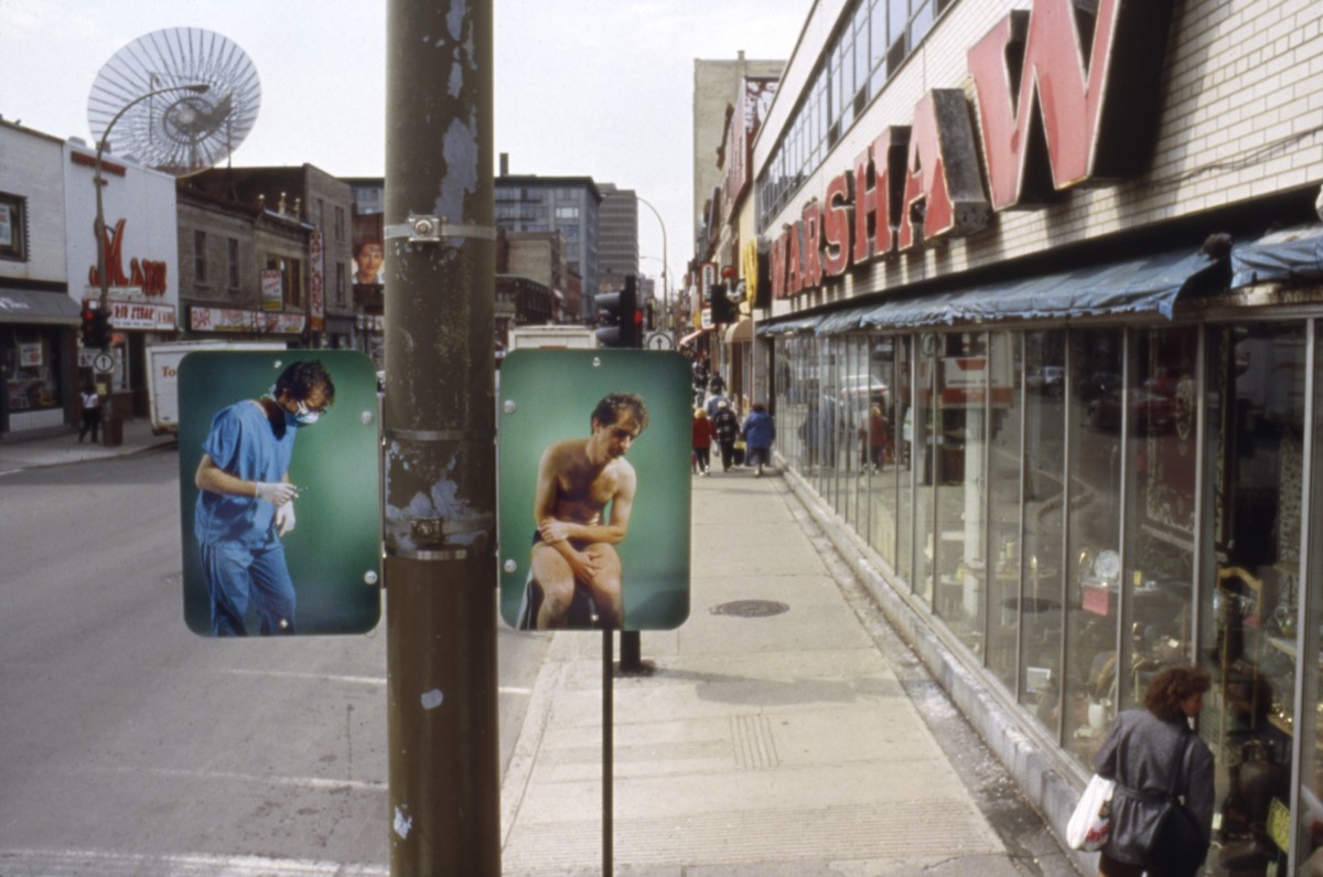 <i>Hésitation</i> – Installation view of diptych 'Institution', lamp posts on boul. Saint-Laurent											, 1996 											<a href=' https://paullitherland.com/artsite_wp/wp-content/uploads/PaulLitherland_1996_Hesitation_SurgeonInstitution01-1200x795.jpg' target='_blank'><img src='https://paullitherland.com/artsite_wp/wp-content/themes/artpress-child/img/artworkDownloadImg.png' title='télécharger image / download image' /></a> 
																						<!-- <a href='' target='_blank'> 
											<img src='/img/artworkPermalinkIcon.png' title='permalink to photo' /></a> -->